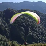 paraglider flying on the hills in bir billing