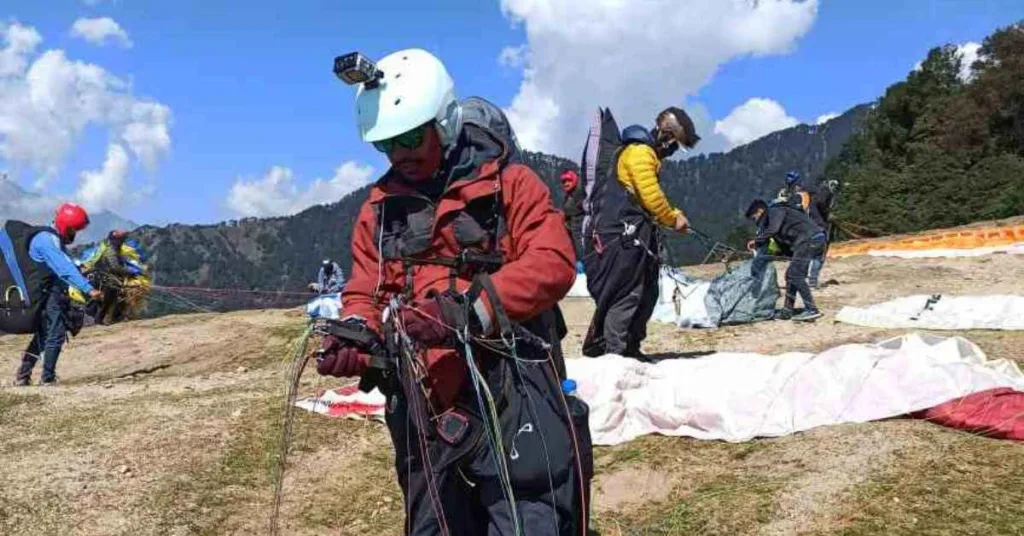 Paraglider with harness canopy hlement and camera