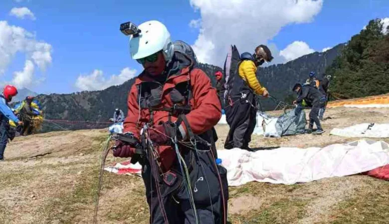 Paraglider with harness canopy hlement and camera